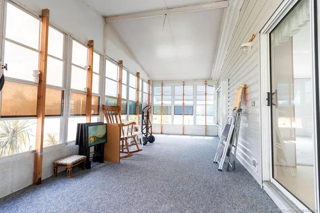 a room with stairs and a large window