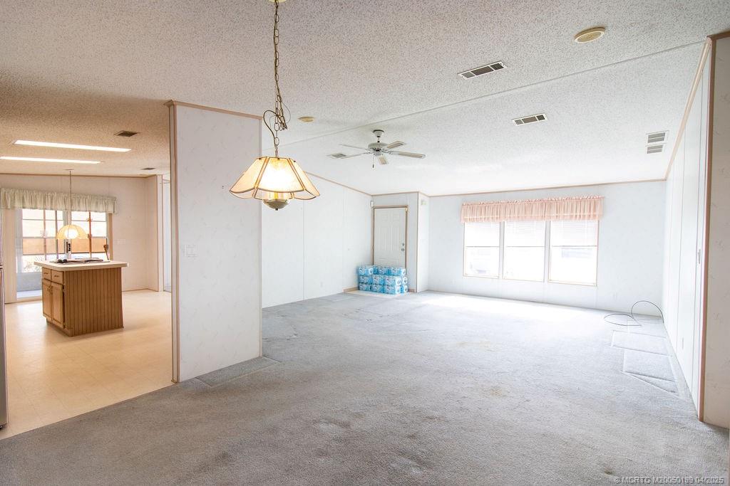 2500 Southwest Marquis Terrace Stuart, FL 34997 - Photo 7 of 20 a view of an empty room with window and cabinet