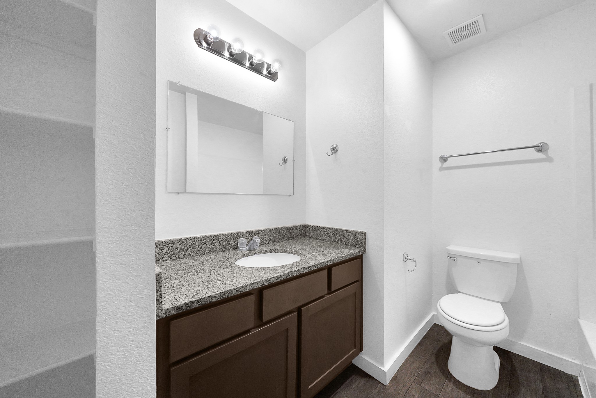 21155 Gosling Road, Unit 24B Spring, TX 77388 - Photo 14 of 23 a bathroom with a granite countertop toilet sink and mirror