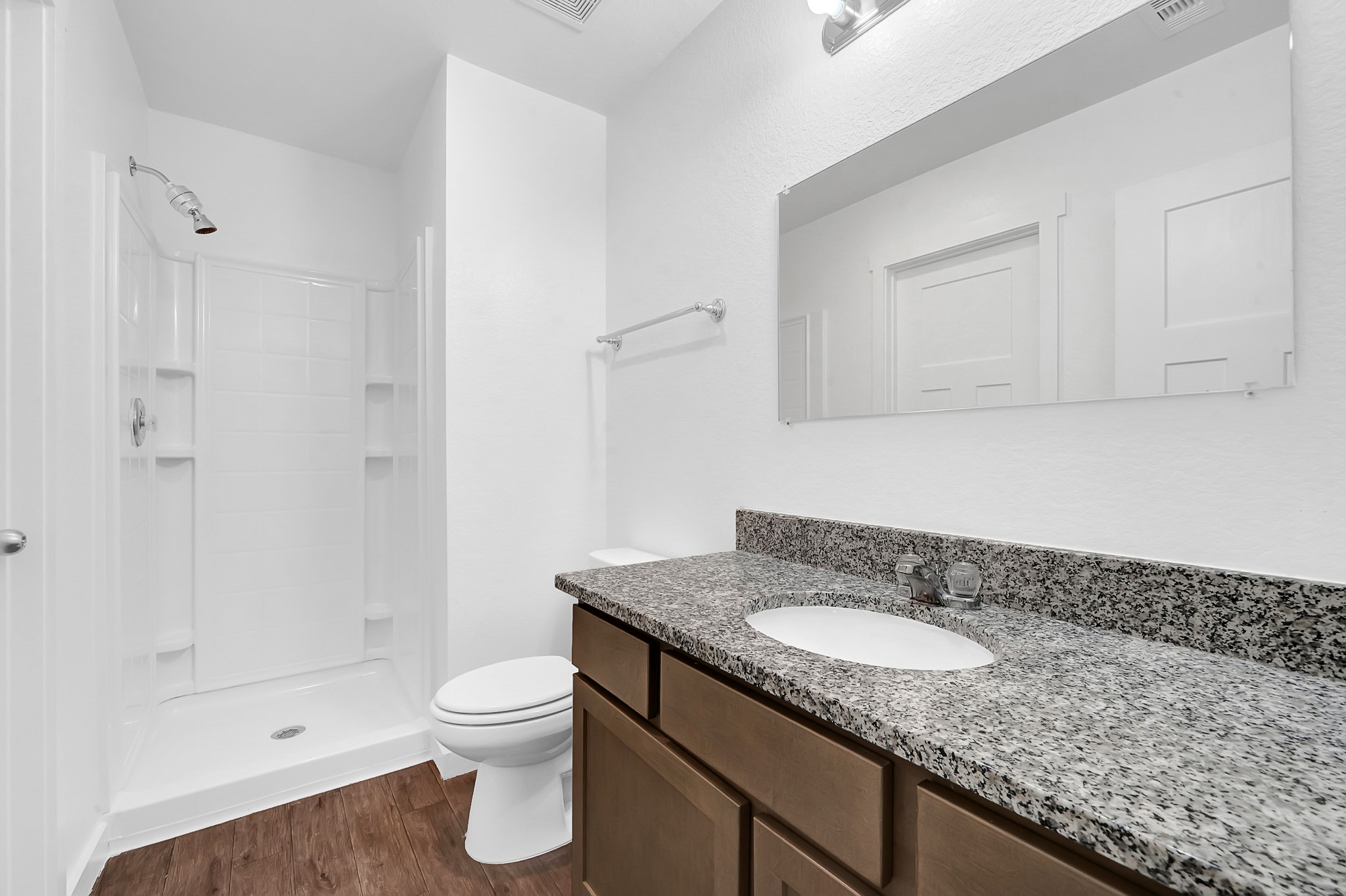 21155 Gosling Road, Unit 24B Spring, TX 77388 - Photo 17 of 23 a bathroom with a granite countertop sink a toilet and shower