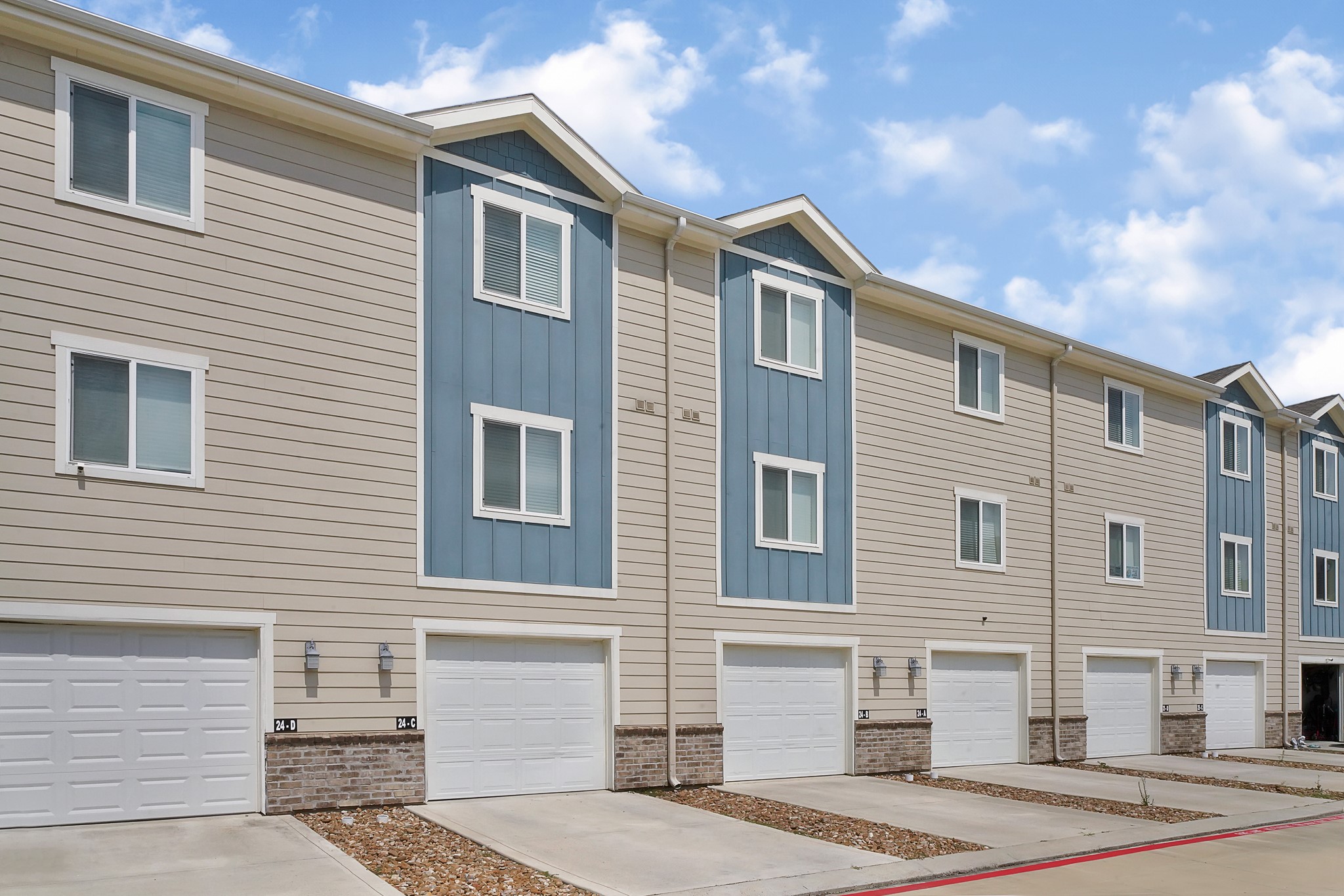 21155 Gosling Road, Unit 24B Spring, TX 77388 - Photo 2 of 23 a front view of a house with a yard