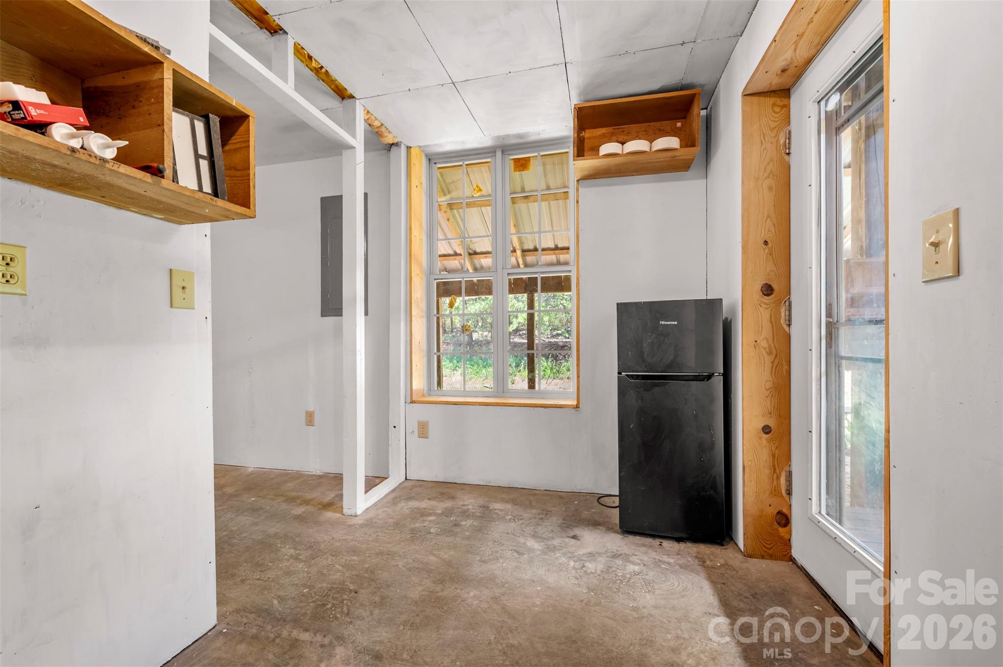 340 Right Prong Road Ellenboro, NC 28040 - Photo 12 of 28 a view of a kitchen with refrigerator and windows