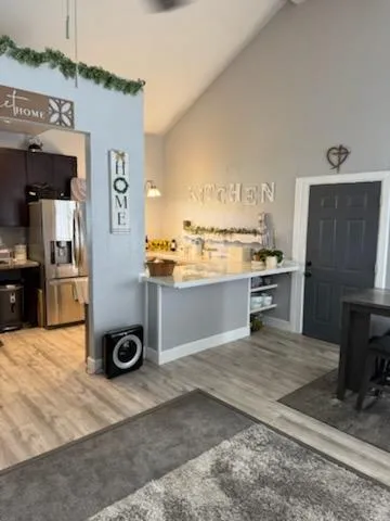 a kitchen with a refrigerator and a stove