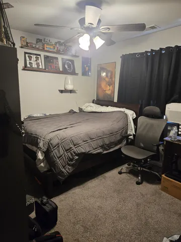 a bathroom with a granite countertop sink a toilet a mirror and shower
