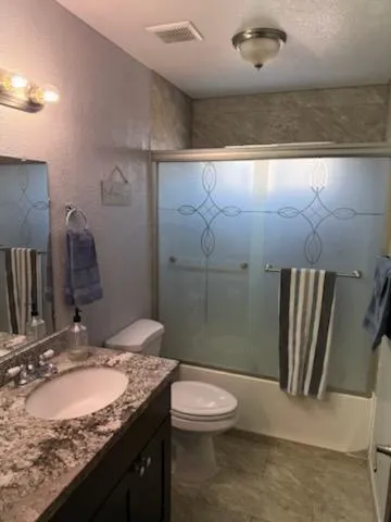 a bathroom with a toilet and a sink