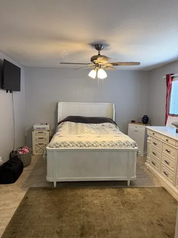 a view of kitchen with stainless steel appliances granite countertop cabinets and wooden floor