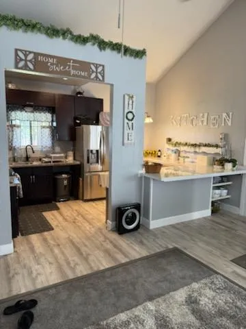 a view of a kitchen with a sink storage and utility