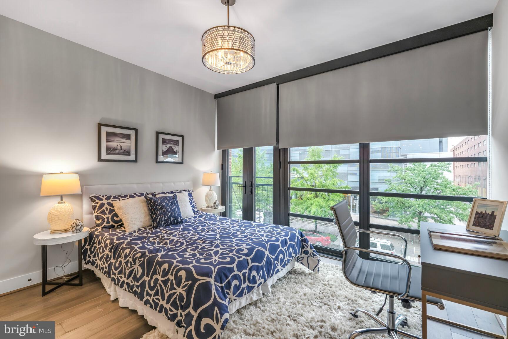 1300 4th Street Southeast, Unit 214 Washington, DC 20003 - Photo 11 of 24 a bedroom with a large bed and a window