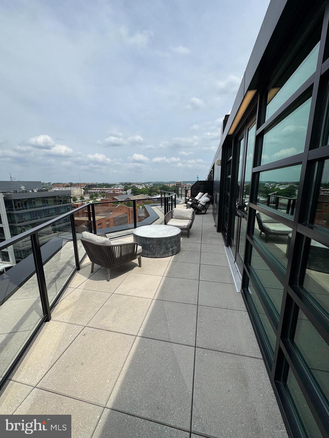 1300 4th Street Southeast, Unit 214 Washington, DC 20003 - Photo 22 of 24 a terrace with outdoor seating and trees