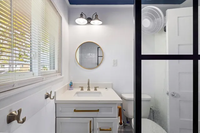 a bathroom with a sink and a mirror