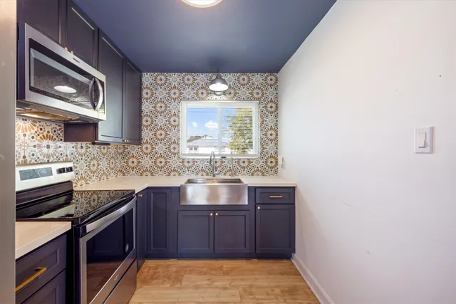 a kitchen with a sink and cabinets