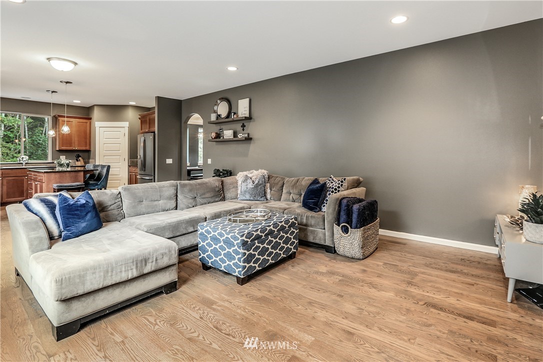 22505 38th Avenue Southeast Bothell, WA 98021 - Photo 13 of 39 a living room with furniture and a couch