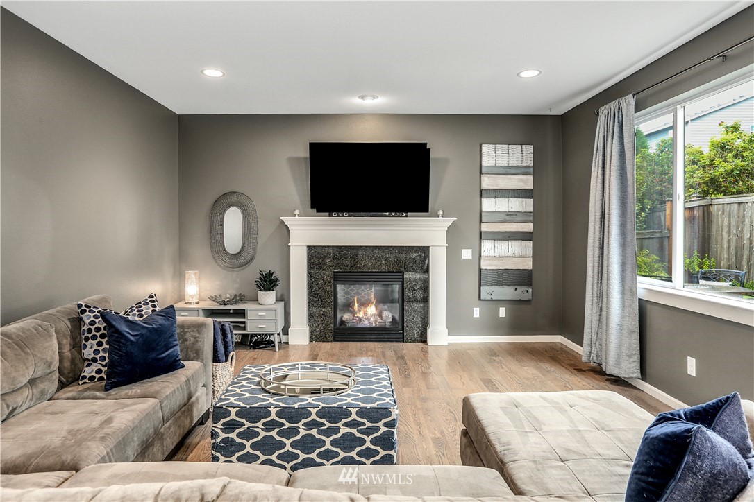 22505 38th Avenue Southeast Bothell, WA 98021 - Photo 15 of 39 a living room with furniture fireplace and window