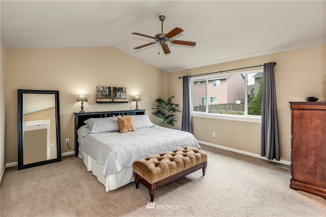 22505 38th Avenue Southeast Bothell, WA 98021 - Photo 17 of 39 a bedroom with a bed mirror and window