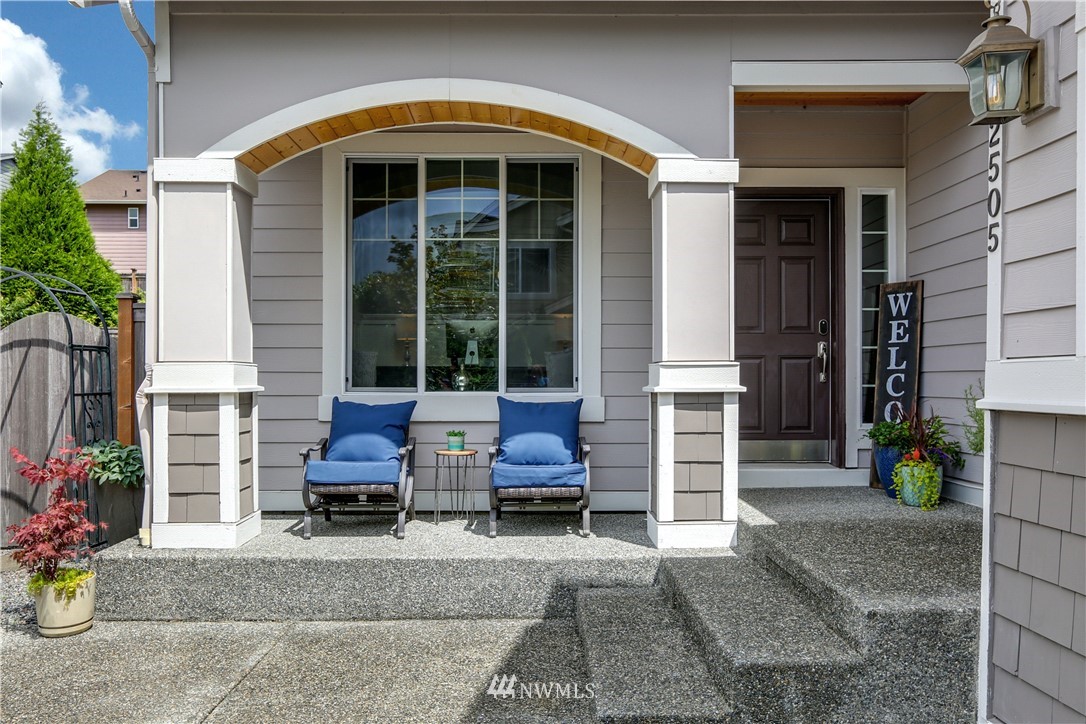 22505 38th Avenue Southeast Bothell, WA 98021 - Photo 3 of 39 a view of a chair and table in front of house