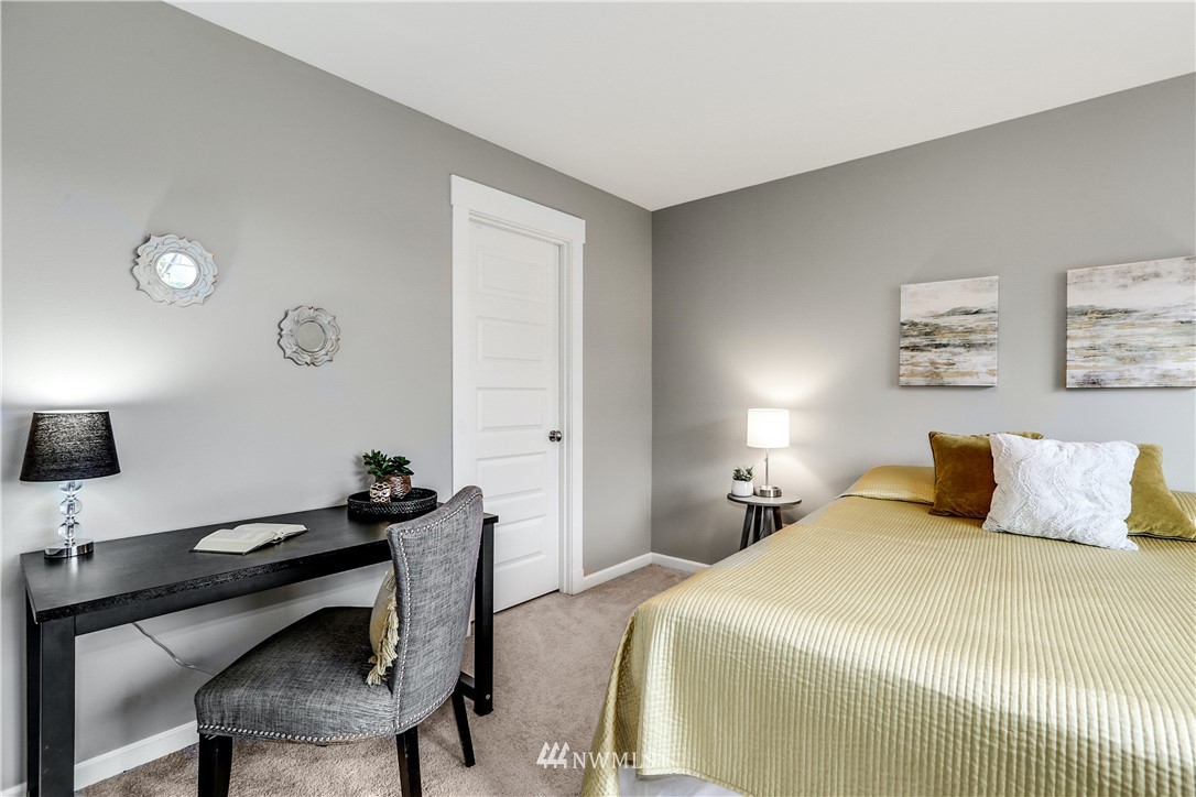 22505 38th Avenue Southeast Bothell, WA 98021 - Photo 21 of 39 a bedroom with a bed and a lamp