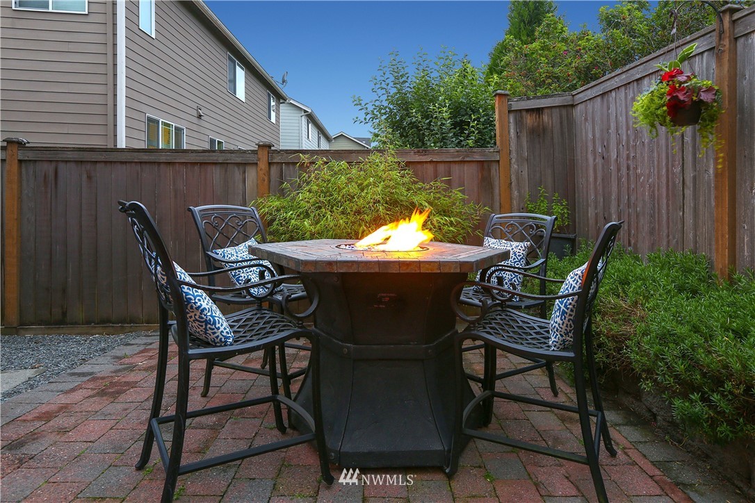 22505 38th Avenue Southeast Bothell, WA 98021 - Photo 32 of 39 a patio with table and chairs