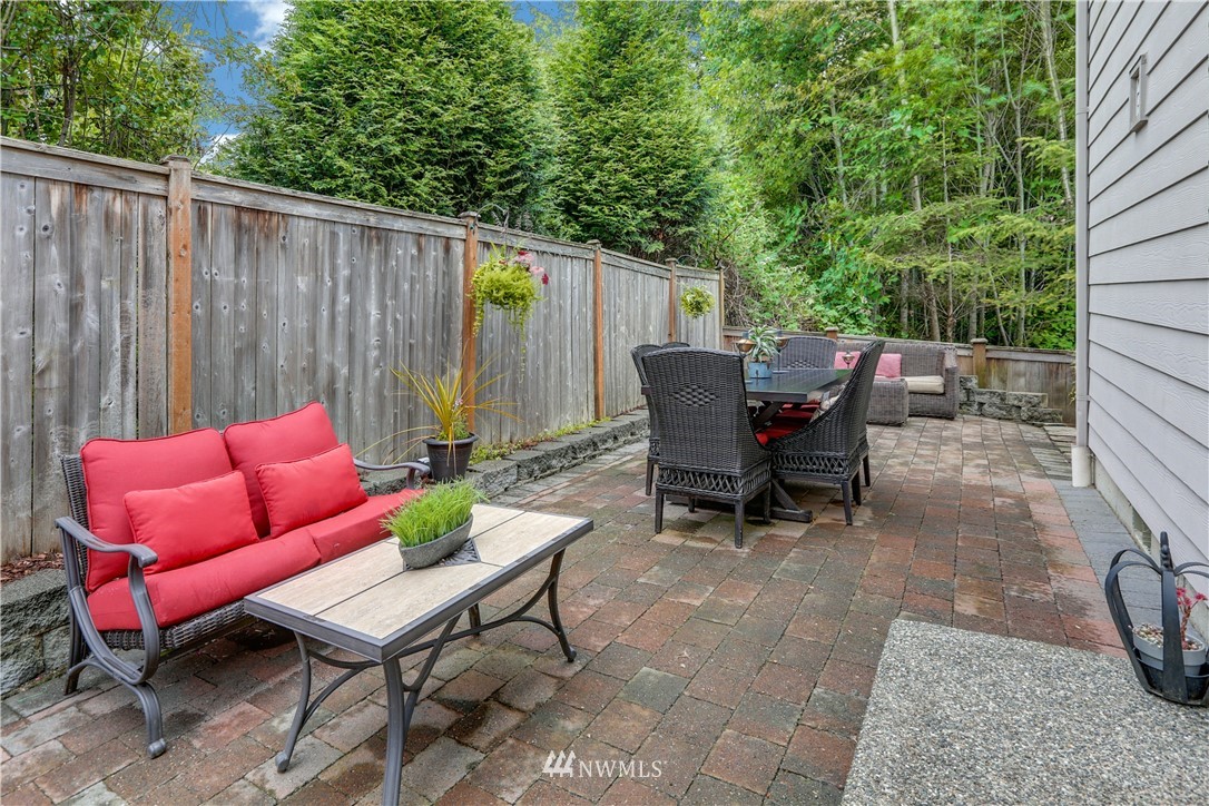 22505 38th Avenue Southeast Bothell, WA 98021 - Photo 33 of 39 a backyard of a house with table and chairs
