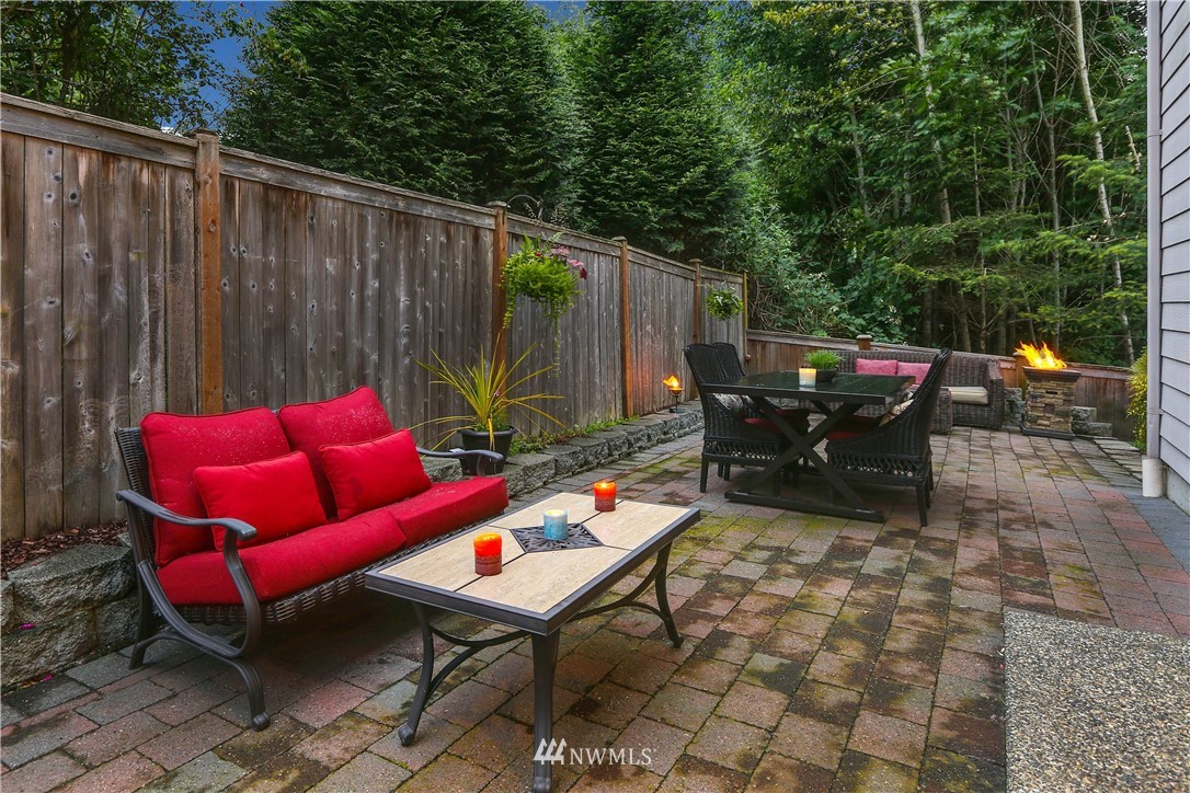 22505 38th Avenue Southeast Bothell, WA 98021 - Photo 35 of 39 a backyard of a house with barbeque oven table and chairs