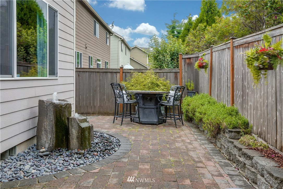 22505 38th Avenue Southeast Bothell, WA 98021 - Photo 36 of 39 a view of a chair and table in backyard of the house