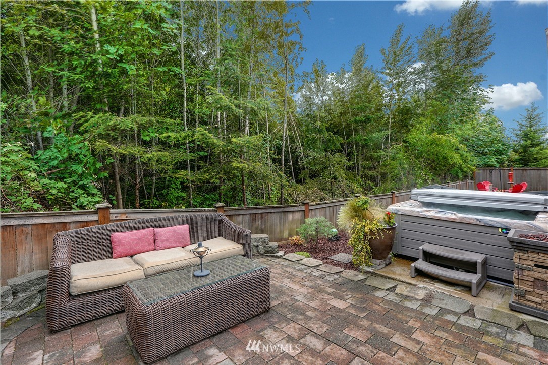 22505 38th Avenue Southeast Bothell, WA 98021 - Photo 37 of 39 a outdoor sitting area with furniture and wooden fence