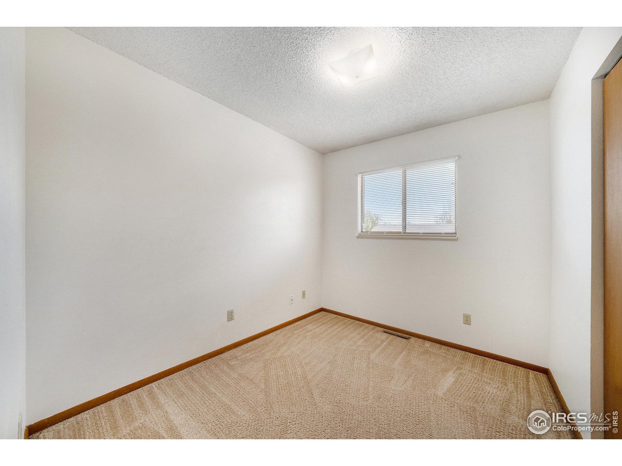 3237 West 5th St Road Greeley, CO 80634 - Photo 12 of 23 a view of an empty room and a window