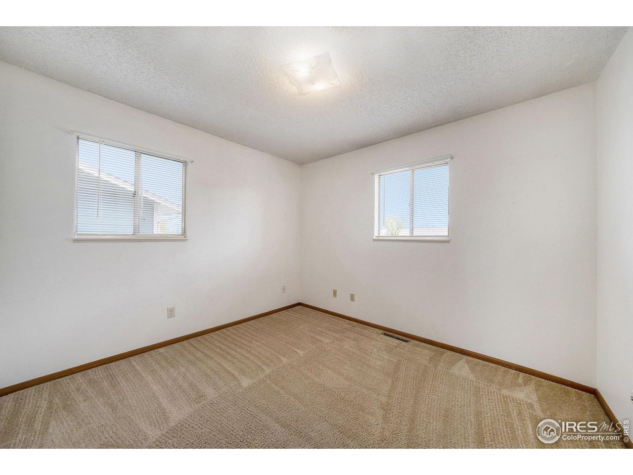 3237 West 5th St Road Greeley, CO 80634 - Photo 14 of 23 a view of an empty room with a window