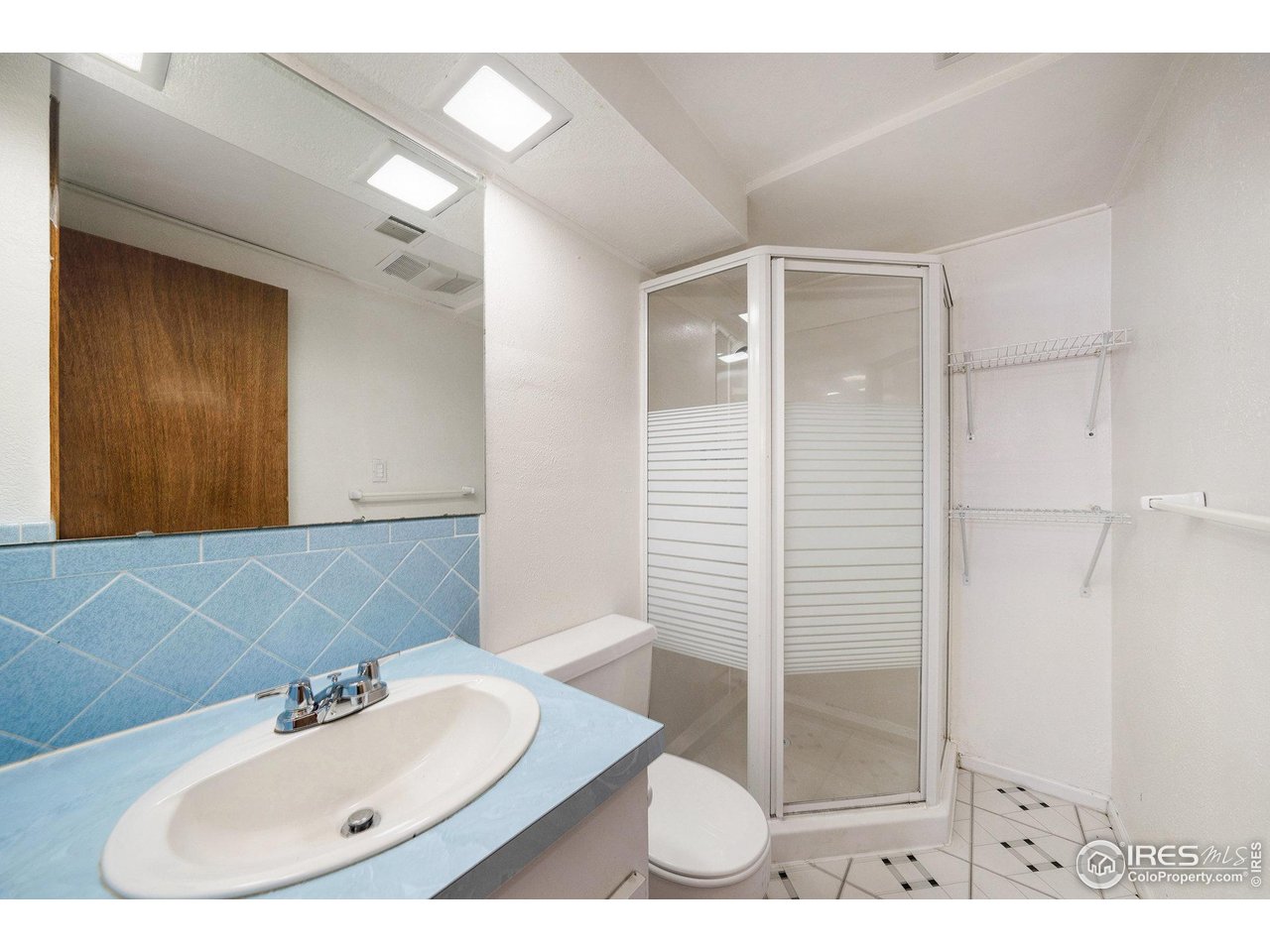 3237 West 5th St Road Greeley, CO 80634 - Photo 18 of 23 a bathroom with a sink and a mirror