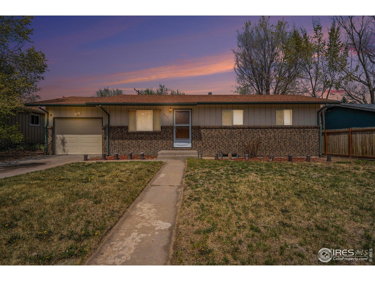 3237 West 5th St Road Greeley, CO 80634 - Photo 2 of 23 a front view of a house with a yard
