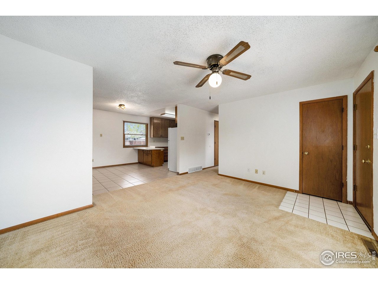3237 West 5th St Road Greeley, CO 80634 - Photo 3 of 23 a view of a room with a kitchen