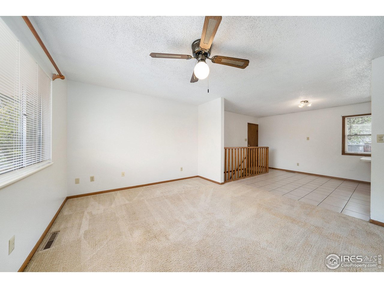 3237 West 5th St Road Greeley, CO 80634 - Photo 5 of 23 a view of an empty room with a window