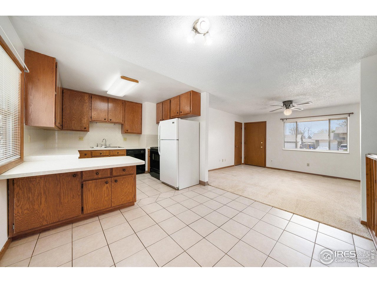 3237 West 5th St Road Greeley, CO 80634 - Photo 7 of 23 a kitchen with a cabinets and window