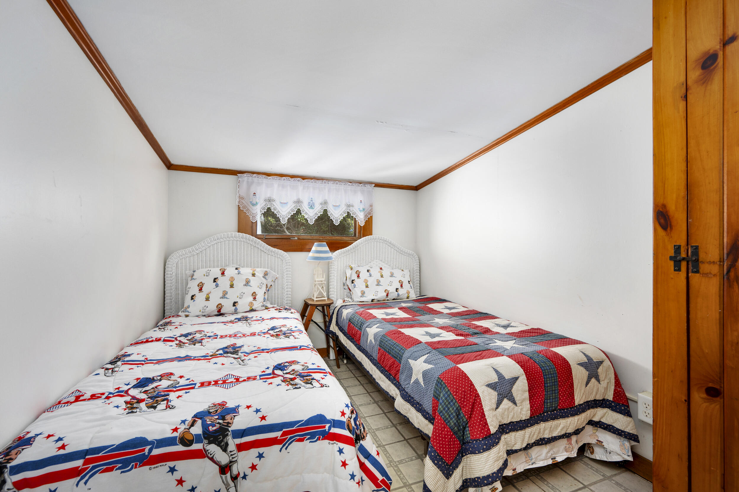 62 Old Fish House Road South Dennis, MA 02660 - Photo 11 of 24 a bedroom with a bed and a painting on the wall