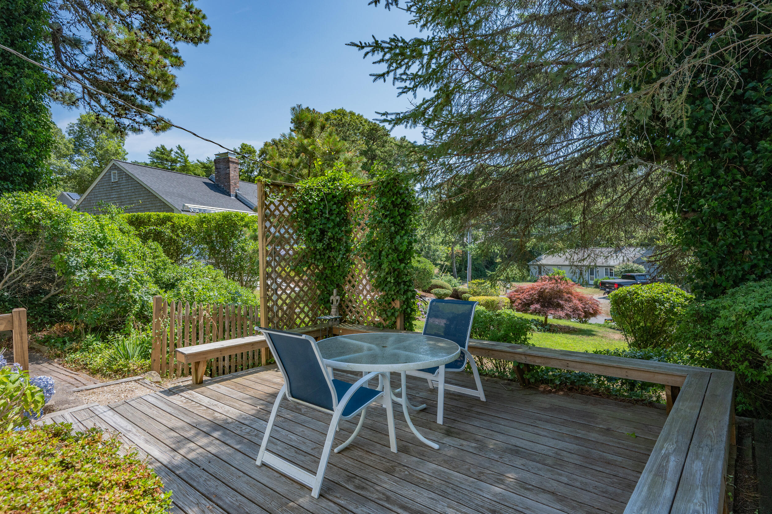 62 Old Fish House Road South Dennis, MA 02660 - Photo 17 of 24 a view of backyard with seating space and trees