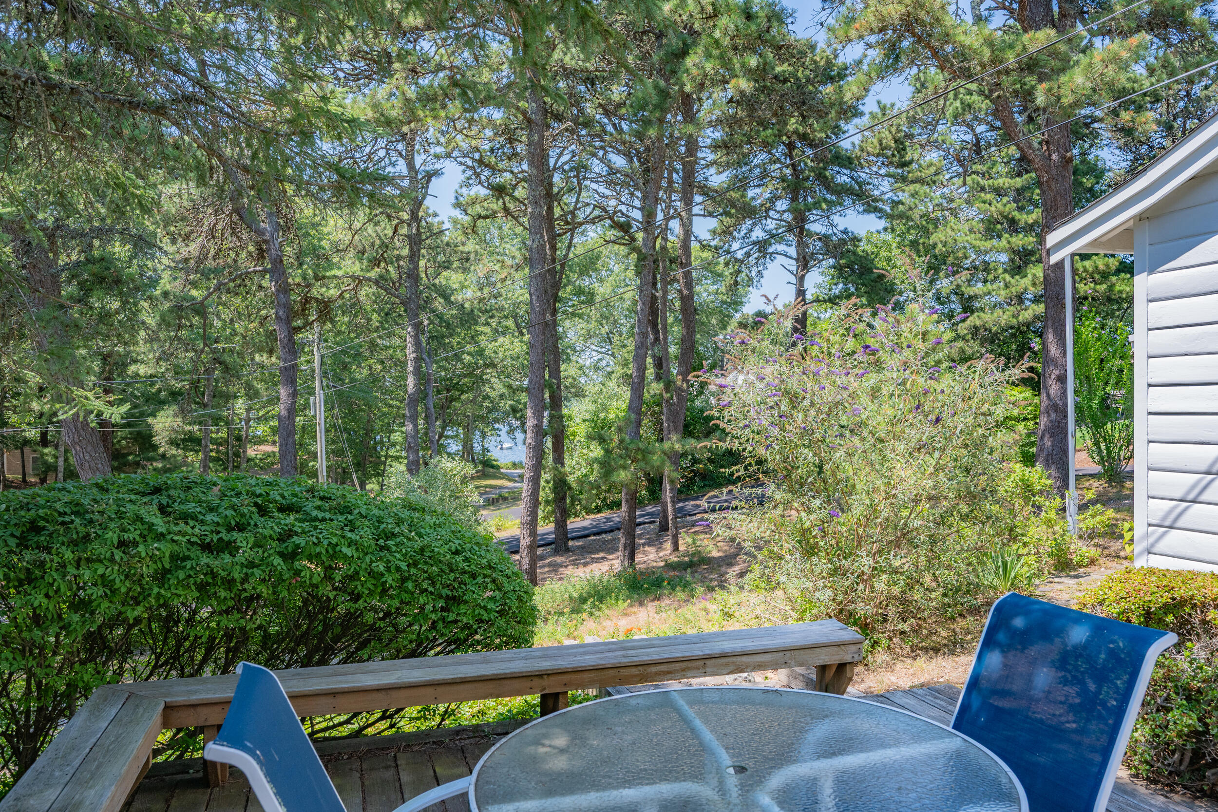 62 Old Fish House Road South Dennis, MA 02660 - Photo 19 of 24 a view of a patio with table and chairs and potted plants