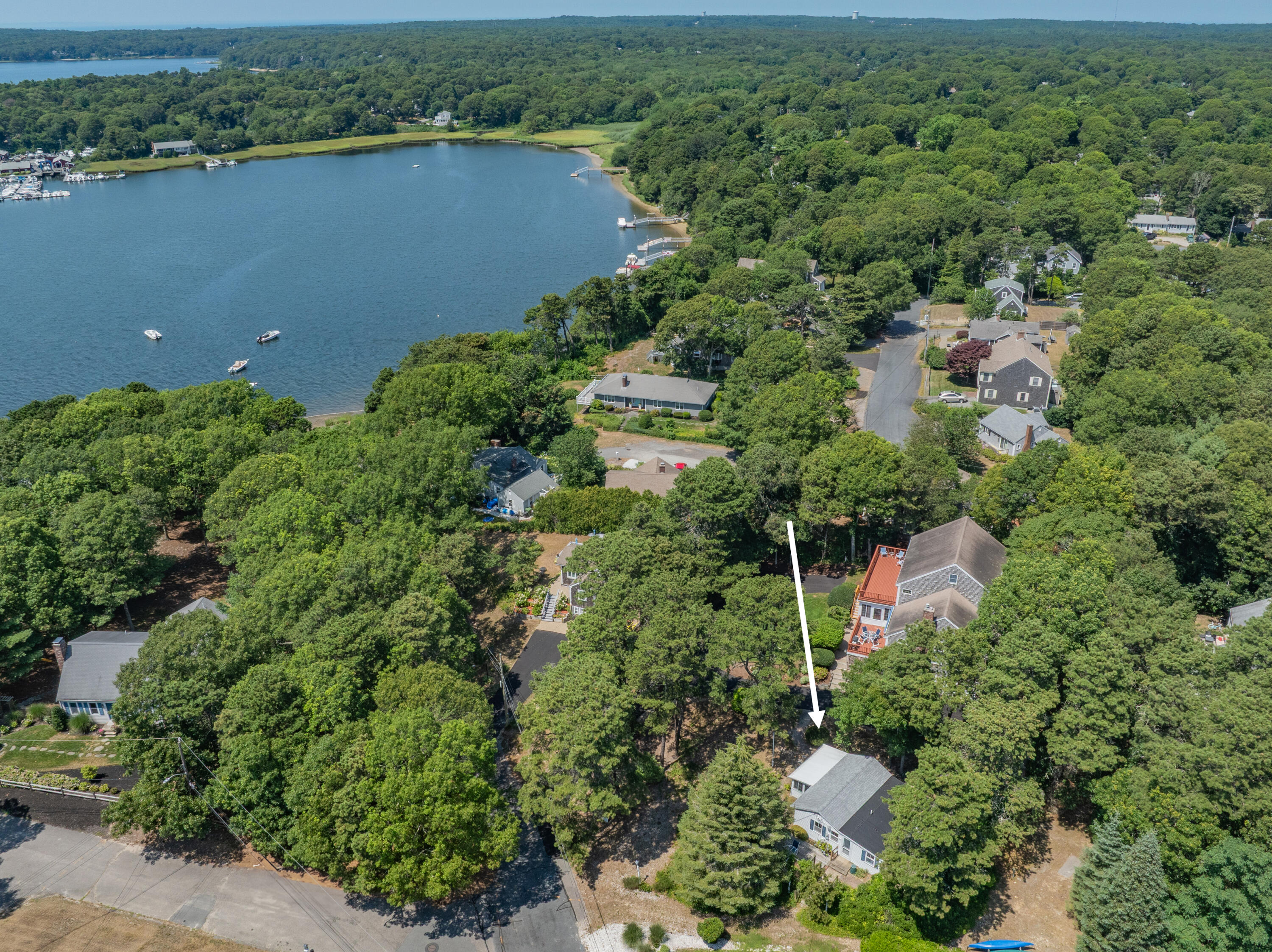 62 Old Fish House Road South Dennis, MA 02660 - Photo 2 of 24 an aerial view of a house with a yard and lake view