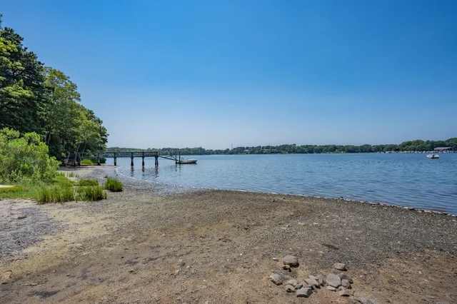 a view of a lake with a building in the background