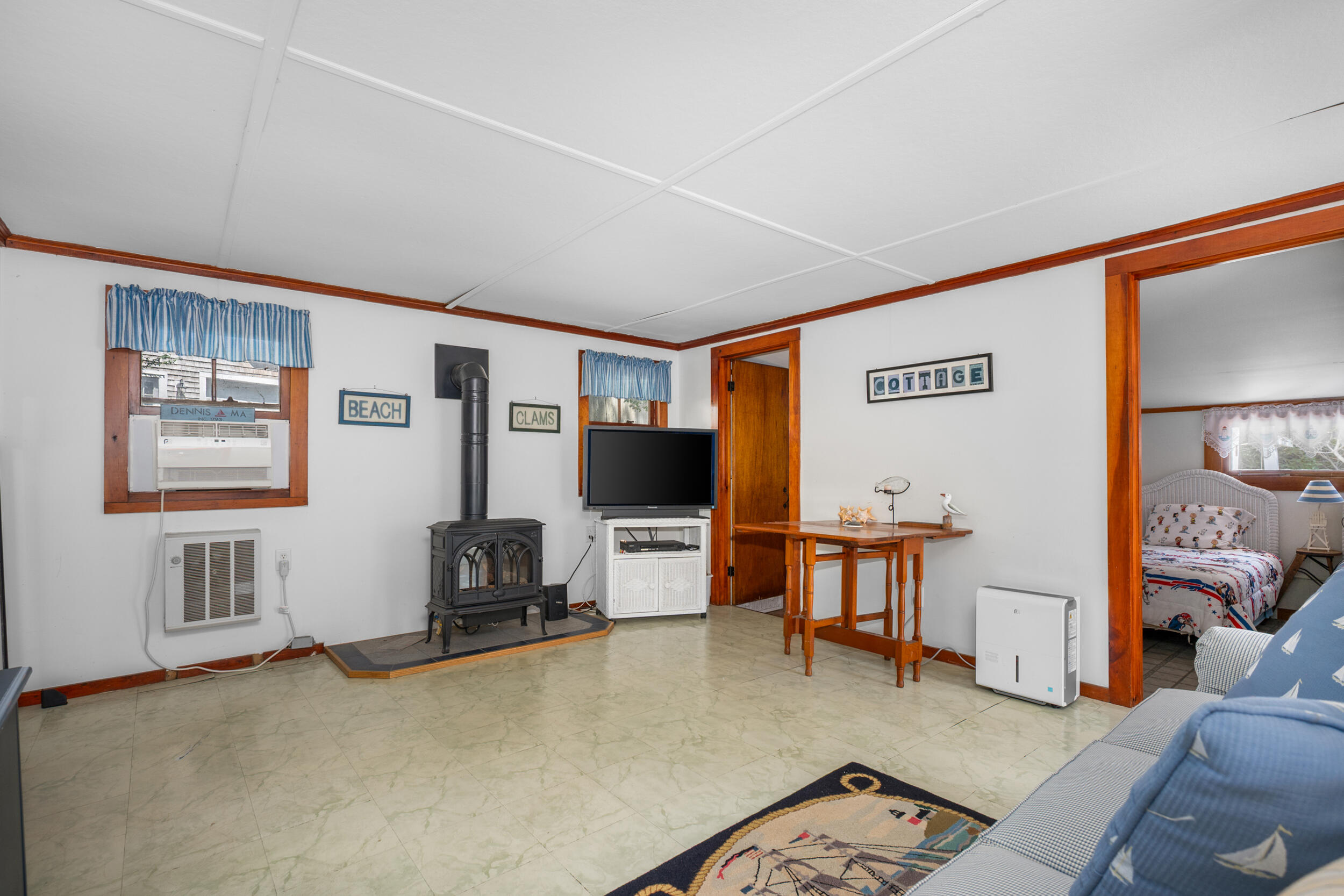 62 Old Fish House Road South Dennis, MA 02660 - Photo 5 of 24 a living room with furniture and a flat screen tv