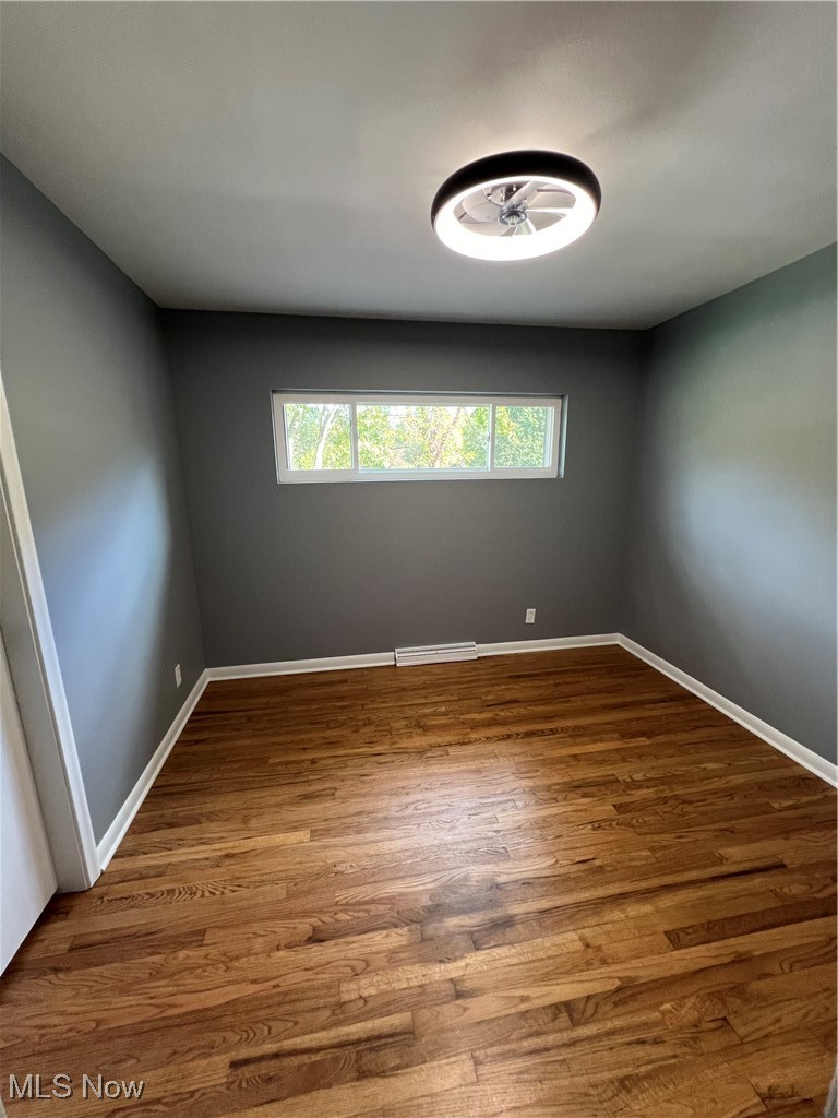 815 Sugar Road Akron, OH 44321 - Photo 15 of 22 Bedroom 3 with hardwood floors and "fandalier."
