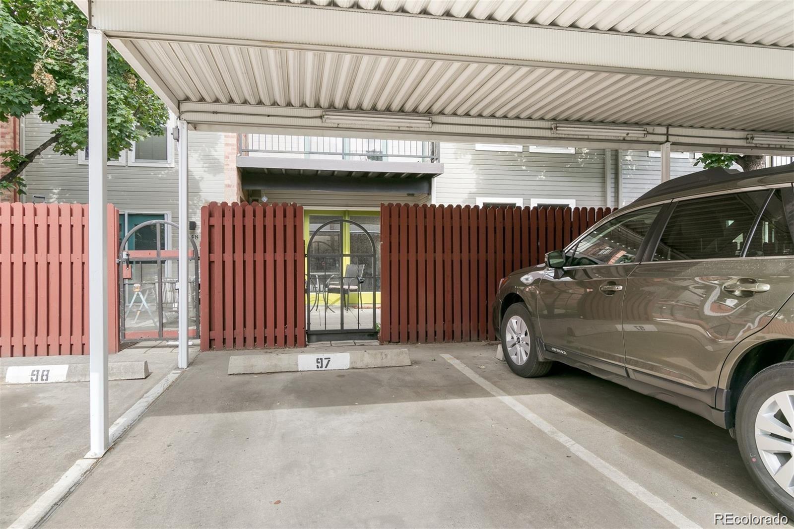 1150 Inca Street, Unit 46 Denver, CO 80204 - Photo 25 of 45 a view of garage with a car parked in it