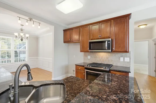 a kitchen with a refrigerator and a sink