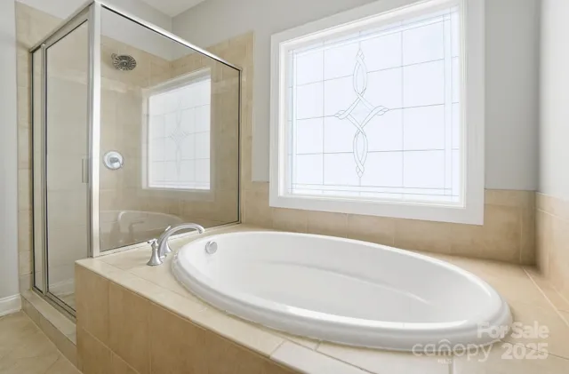 a white bath tub sitting next to a window
