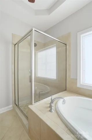 a bathroom with a tub a sink and a shower
