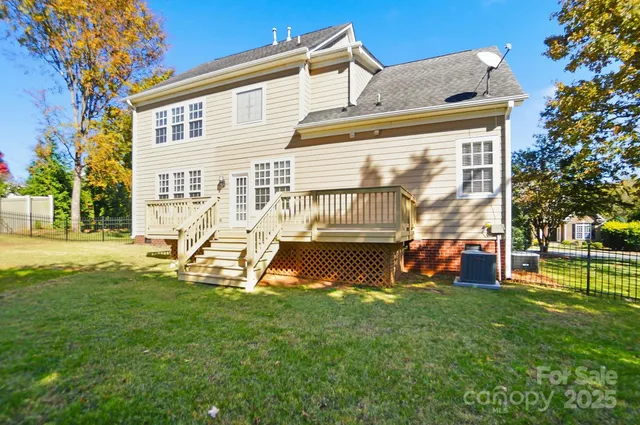 a view of a house with a backyard porch and sitting area