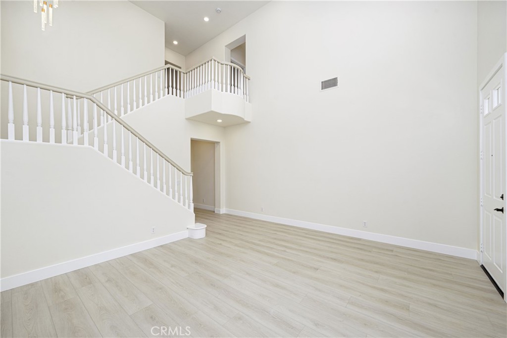 15 Plum Street Ladera Ranch, CA 92694 - Photo 19 of 113 a view of staircase with wooden floor and white walls