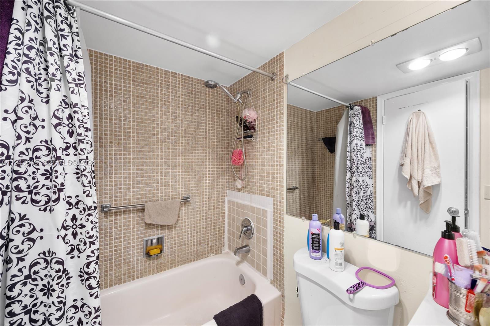 446 Durham O, Unit 446 Deerfield Beach, FL 33442 - Photo 17 of 26 a bathroom with a sink toilet tub and shower