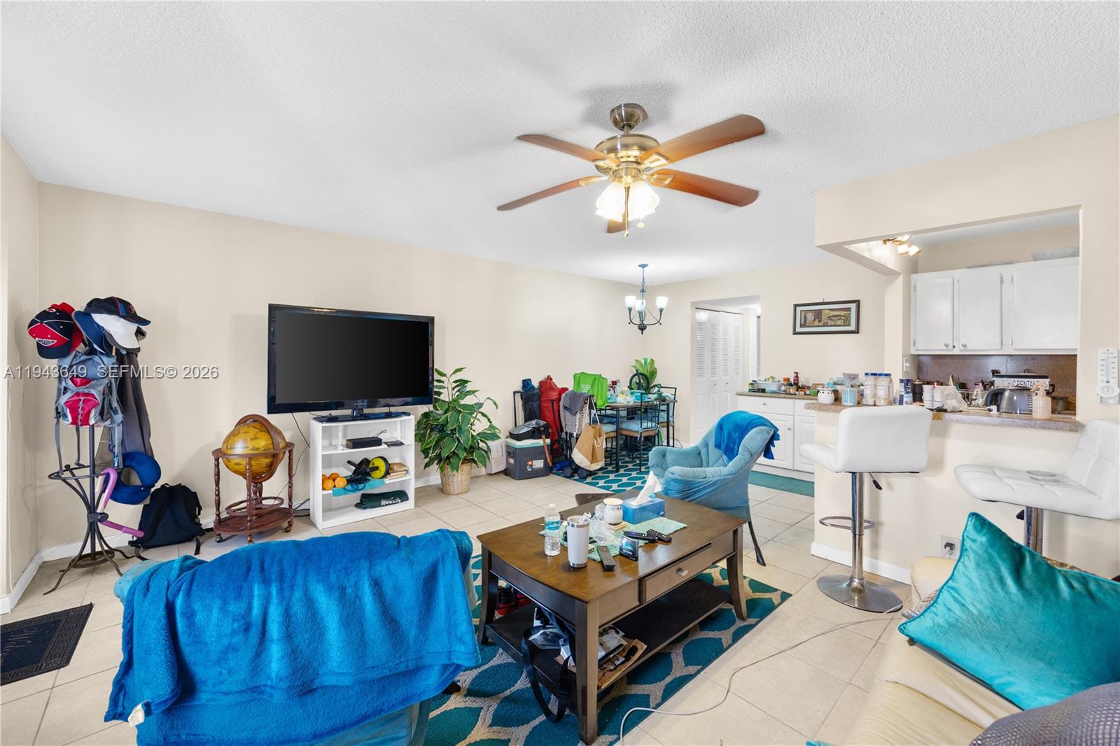 446 Durham O, Unit 446 Deerfield Beach, FL 33442 - Photo 2 of 26 a living room with furniture and a flat screen tv