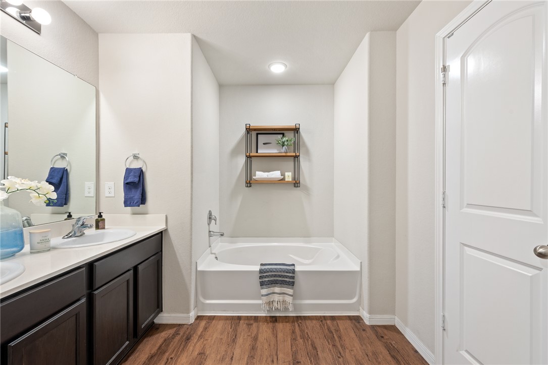 2018 Eagle View Drive Navasota, TX 77868 - Photo 17 of 28 a bathroom with a sink and a mirror