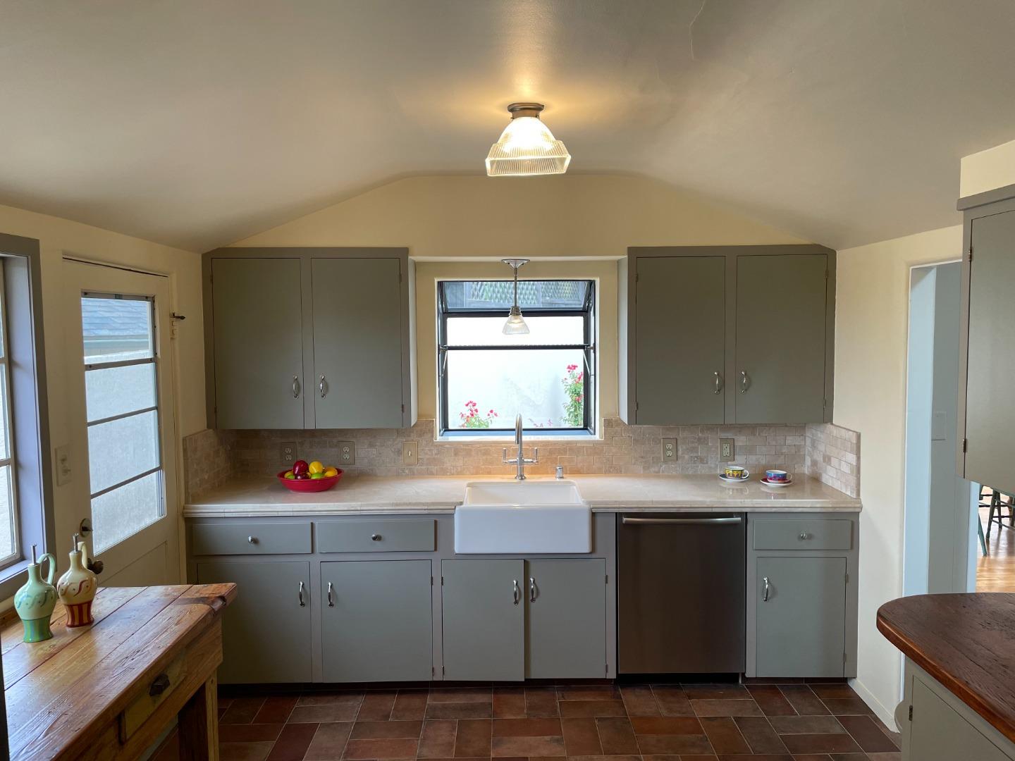 529 Monterey Drive Aptos, CA 95003 - Photo 15 of 32 a kitchen with a sink cabinets and window