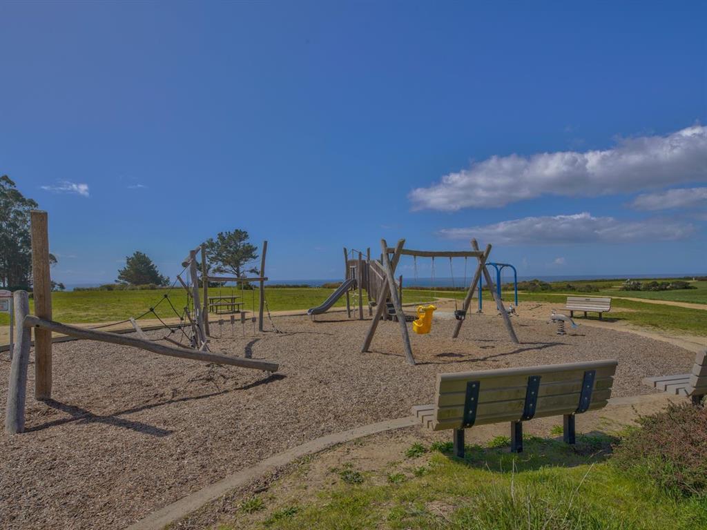 529 Monterey Drive Aptos, CA 95003 - Photo 32 of 32 a view of a lake with a table and chairs